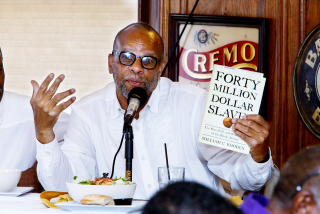 William C. Rhoden tells the Journalists Roundtable in Washington last August about penalties faced by black athletes who protested in earlier eras. (Sharon Farmer/sfphotoworks)